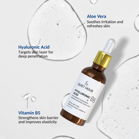 Skincare dropper bottle with ingredients labeled on a light background